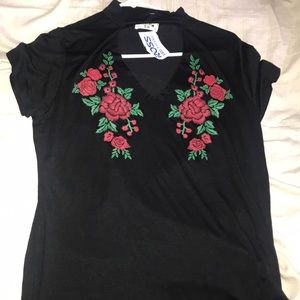 Black, choker t shirt w/ red roses.